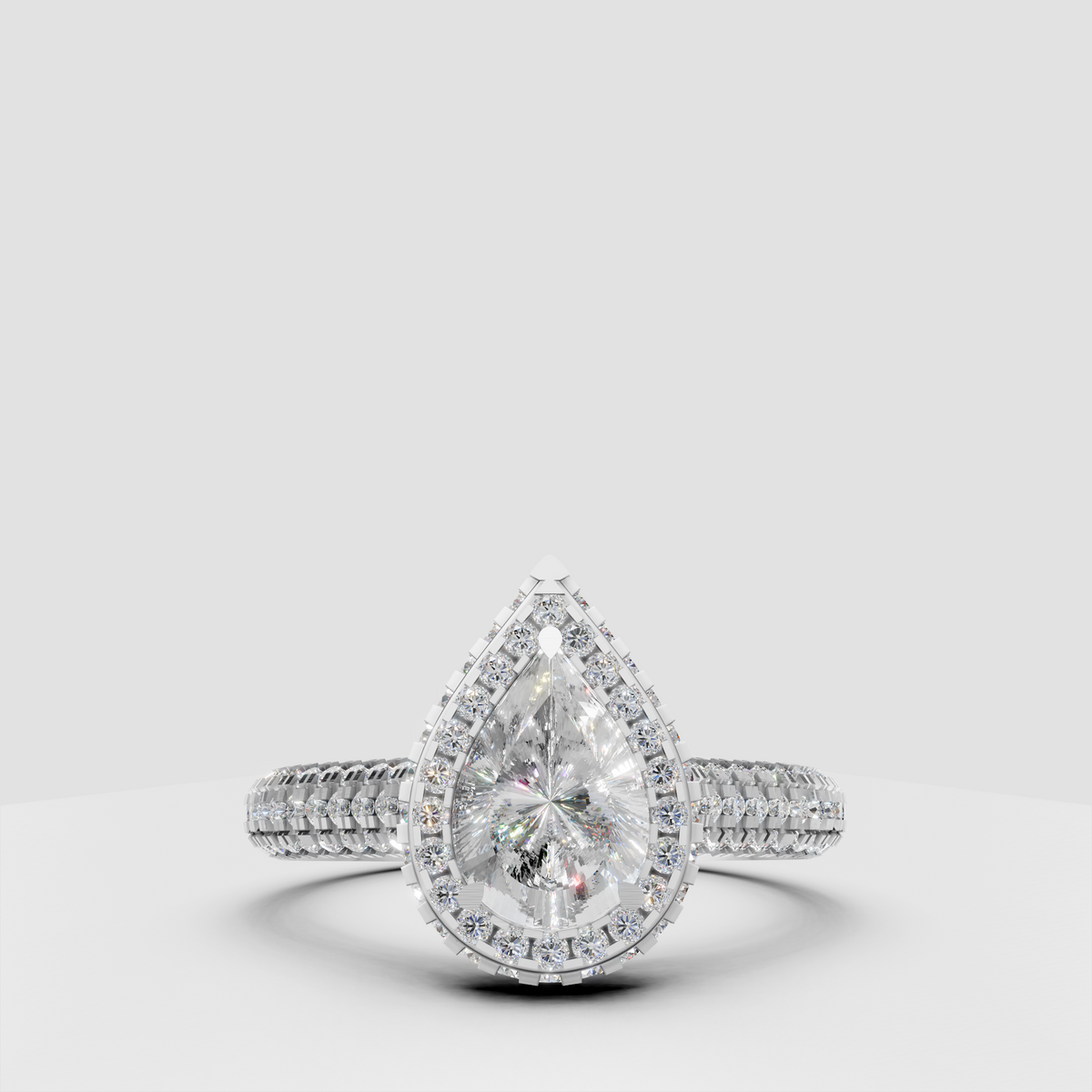 The Lumina Pear Halo Ring